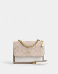 Mini Klare Crossbody Bag In Signature Canvas (Gold/Sand/Chalk)