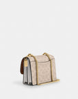 Mini Klare Crossbody Bag In Signature Canvas (Gold/Sand/Chalk)