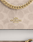 Mini Klare Crossbody Bag In Signature Canvas (Gold/Sand/Chalk)
