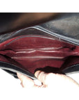 s GCCI saddle bag in black leather with muted gold hardware, an expandable bottom, wide shoulder strap, and burgundy leather lining