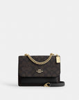Mini Klare Crossbody Bag In Signature Canvas (Gold/Walnut/Black)