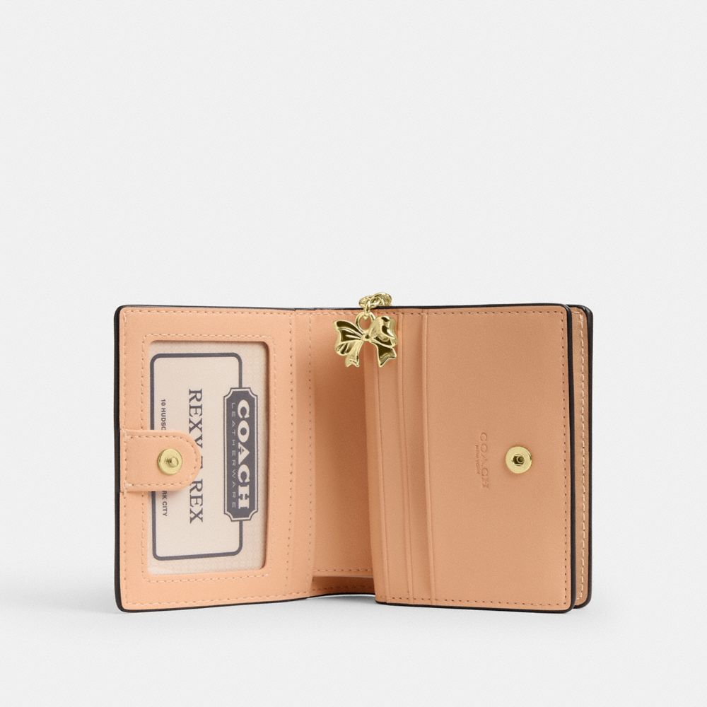 Snap Wallet In Signature Leather With Charm (Gold/Faded Blush)