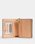 Snap Wallet In Signature Leather With Charm (Gold/Faded Blush)