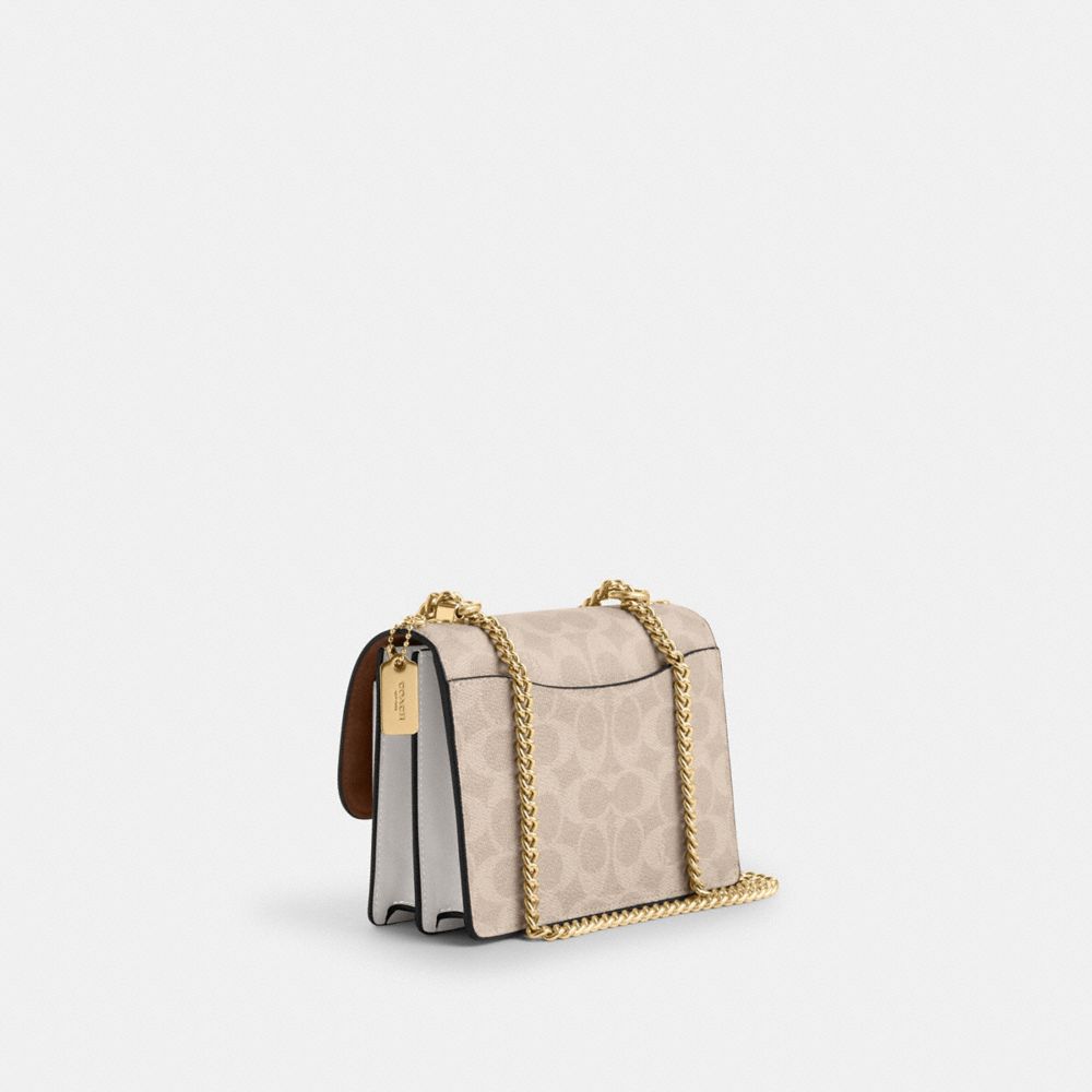Mini Klare Crossbody Bag In Signature Canvas (Gold/Sand/Chalk)