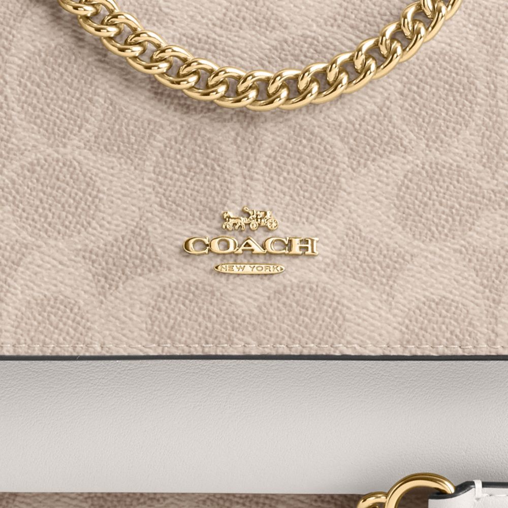 Mini Klare Crossbody Bag In Signature Canvas (Gold/Sand/Chalk)