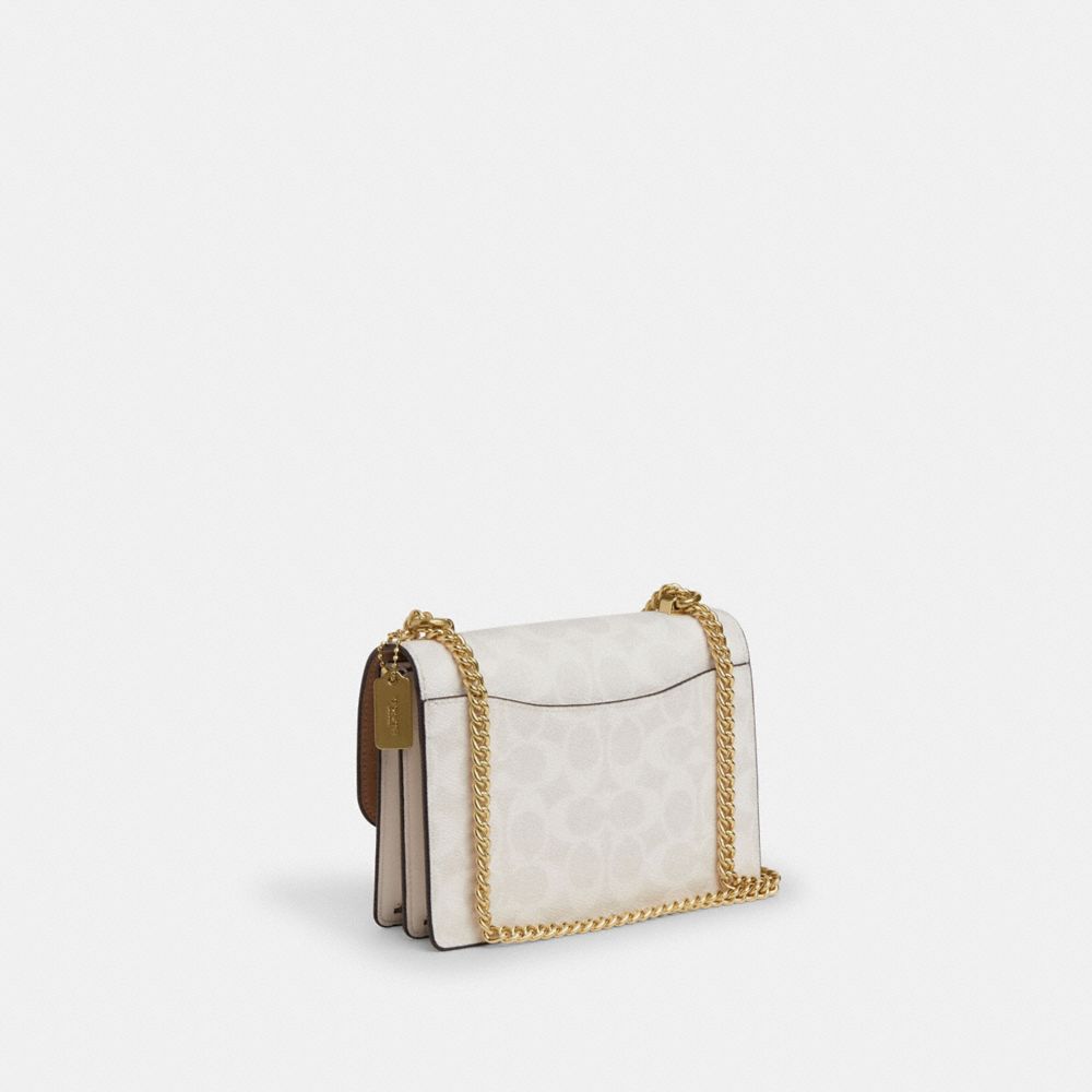 Mini Klare Crossbody Bag In Signature Canvas (Gold/White/Chalk)