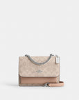 Mini Klare Crossbody Bag In Signature Canvas (Silver/Sand/Taupe)