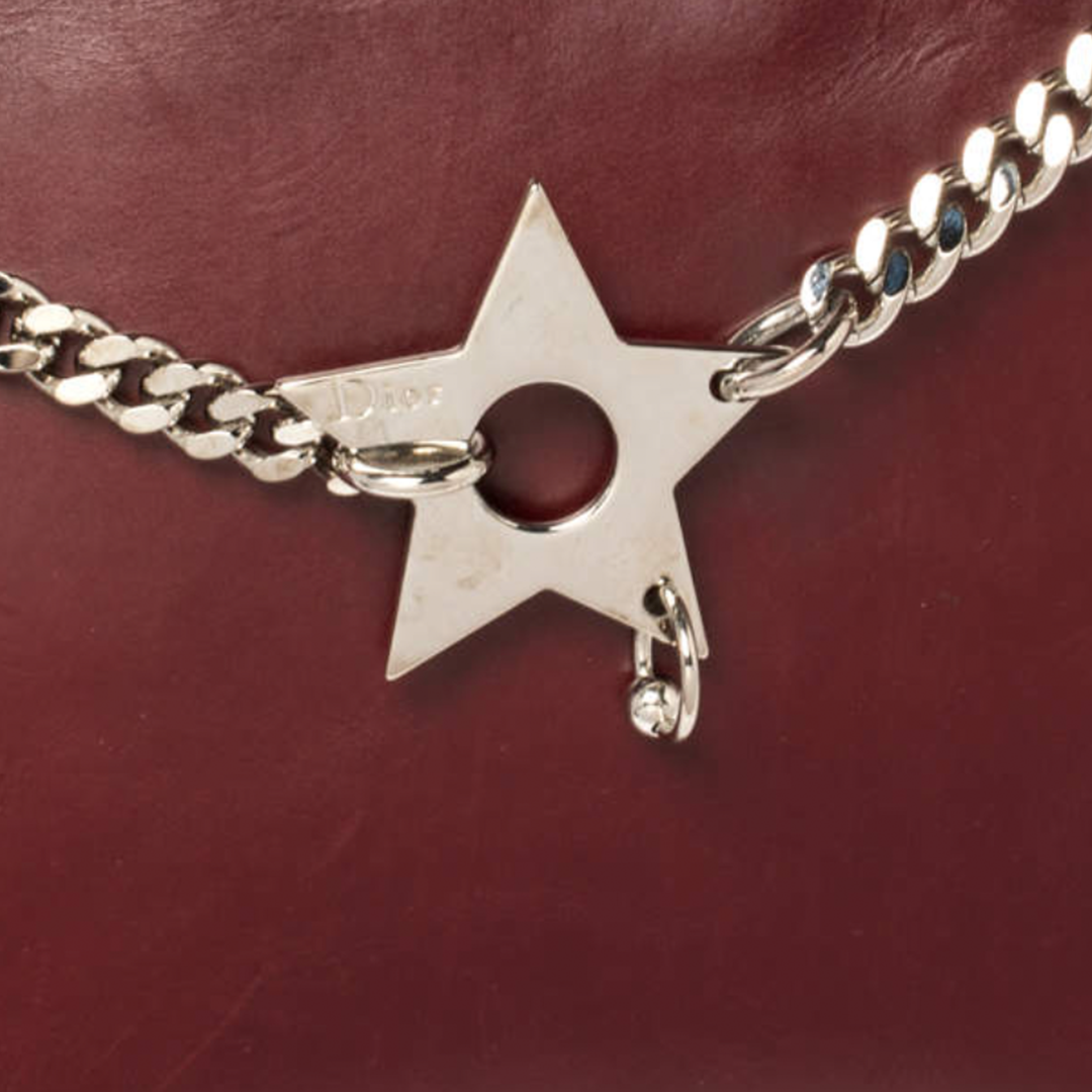 CHRISTIAN DOR BURGUNDY LEATHER PIERCED HARDCORE TOTE BAG